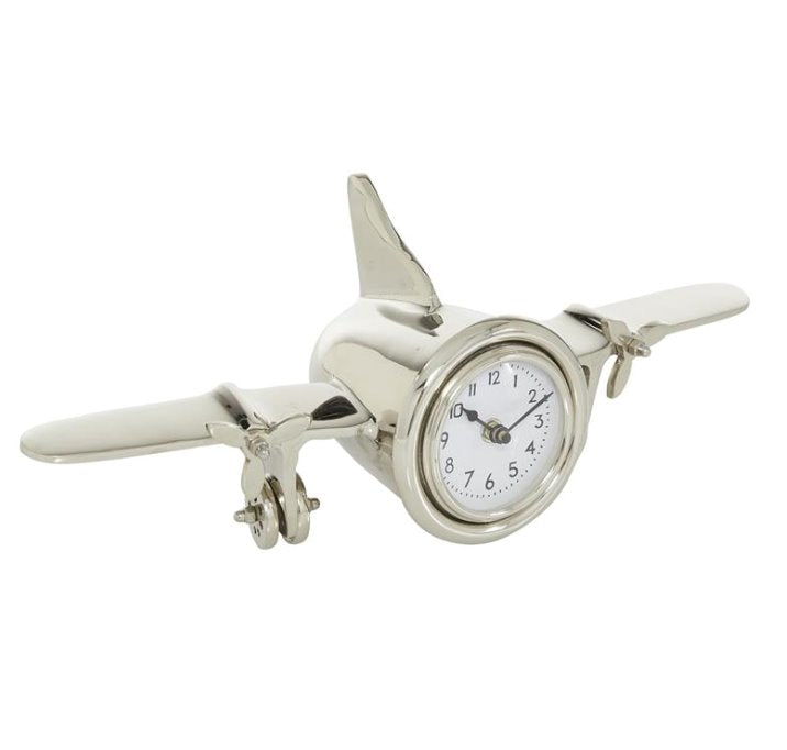 Horloge en métal argenté en forme d'avion