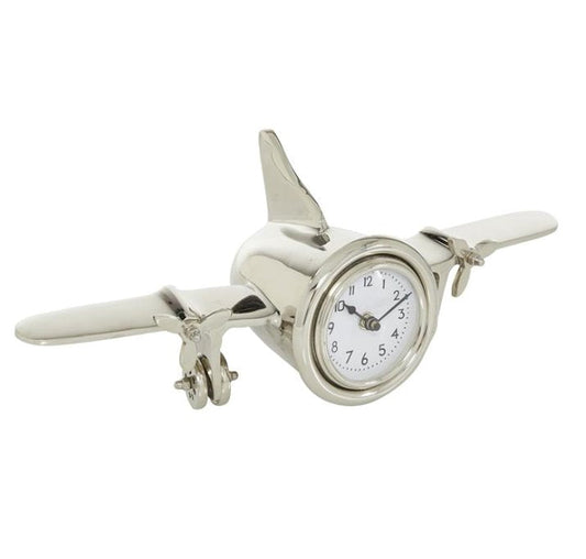 Horloge en métal argenté en forme d'avion